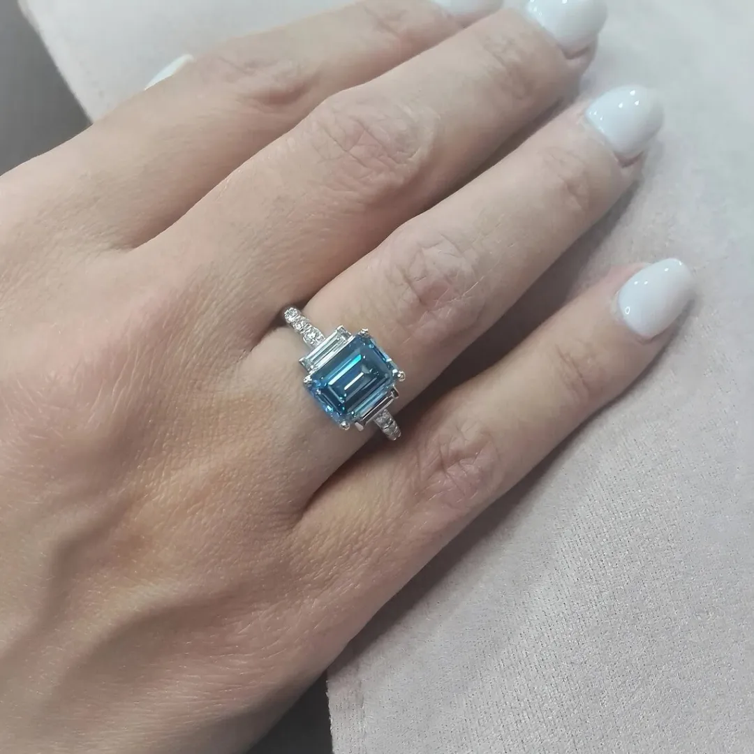 /public/photos/live/Blue Emerald Cut Moissanite Three Stone Engagement Ring 610 (1).webp